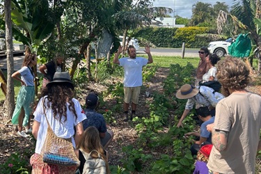 Rodrigo, the garden designer and syntropic guru explaining the principles of syntropics at the Paddock project garden.