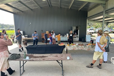 Karen presenting to attendees of the Paddock Project market garden