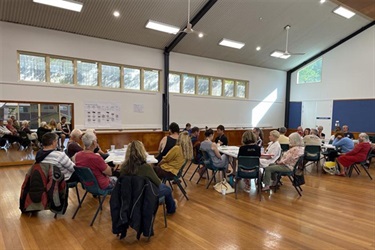 Community members sat around tables workshopping ideas at the Place Planning meeting