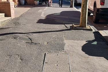 Damaged footpath in Byron Street